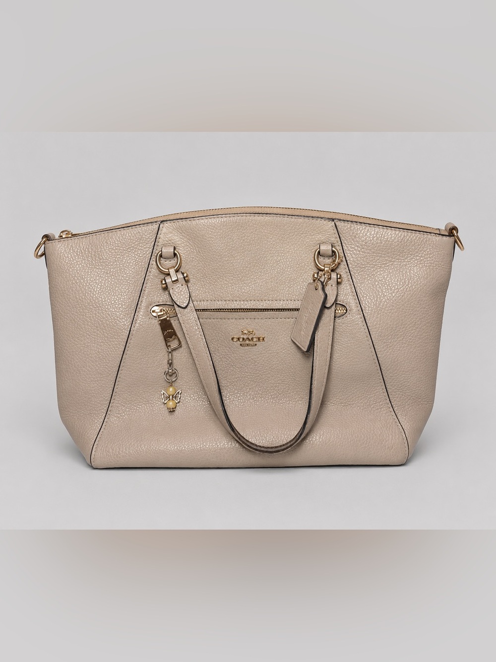 Coach Women's Beige Pebbled Leather Tote Bag
- Classic Everyday Handbag